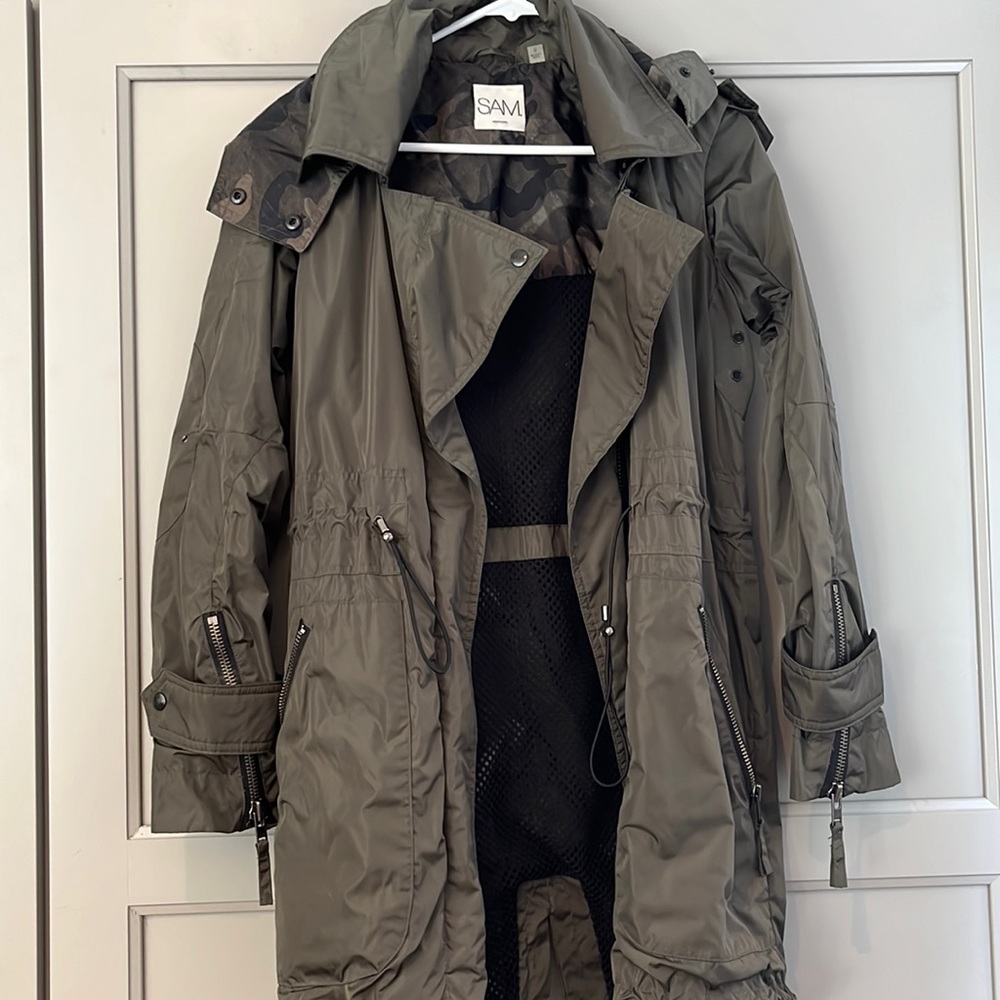 Green SAM. Hooded rain jacket.